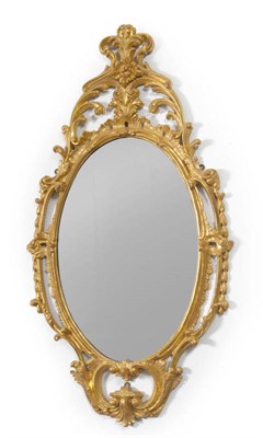 Lot 1413 - An 18th Century Gilt Gesso Looking Glass, the oval plate contained within a C scroll rococo...