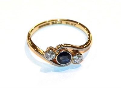 Lot 11 - A sapphire and diamond twist ring, stamped '18CT' and 'PLAT', finger size L1/2