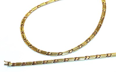 Lot 14 - A bi-colour fancy link necklace and bracelet suite, stamped '375', length 43cm and 18.5cm