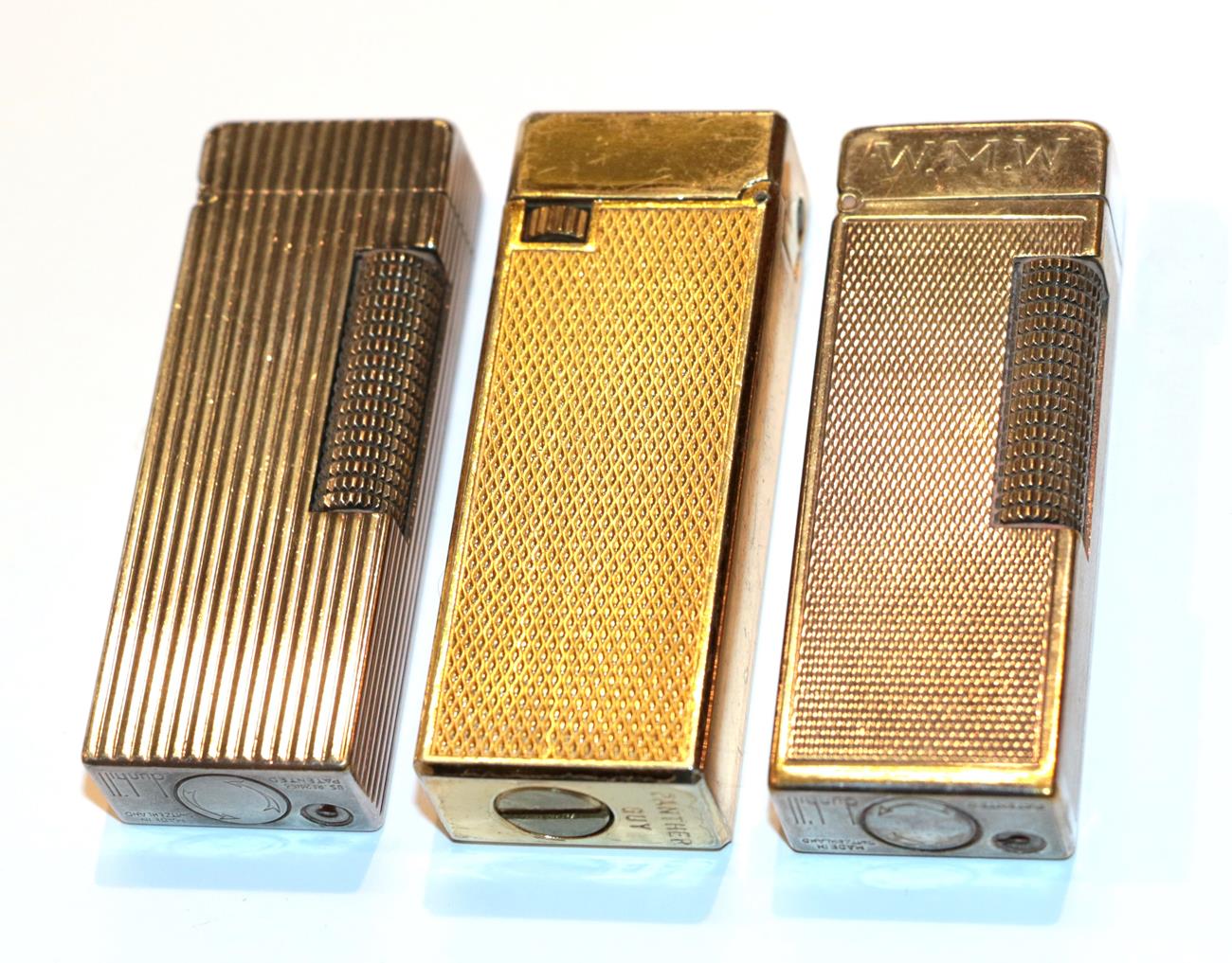 Lot 24 - Two Dunhill lighters and another