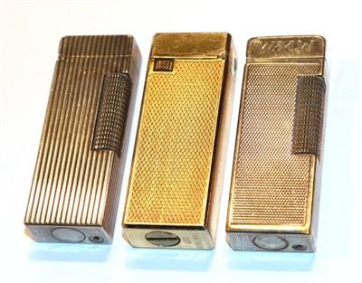 Lot 24 - Two Dunhill lighters and another
