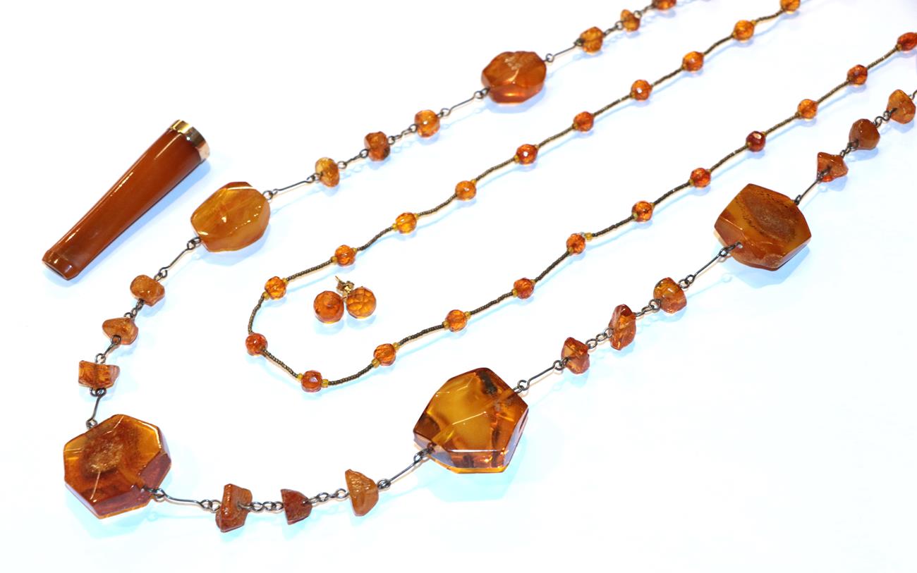 Lot 27 - An amber bead necklace, formed of irregular shaped amber beads, length 86cm (approximately),...