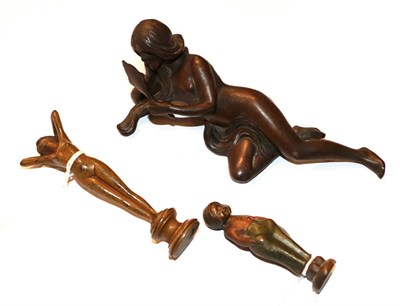 Lot 45 - An Art Nouveau bronze figure of a reclining nude 15cm long, together with two figural desk...