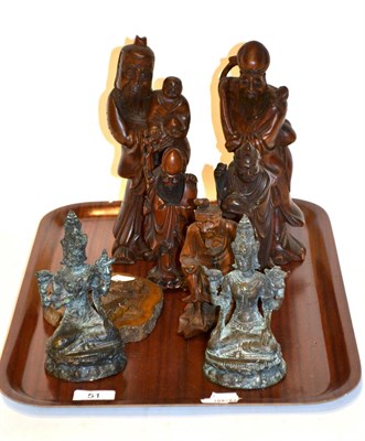 Lot 51 - Five Chinese carved wooden figures together with two Tibetan bronzed figures and a plaque,...