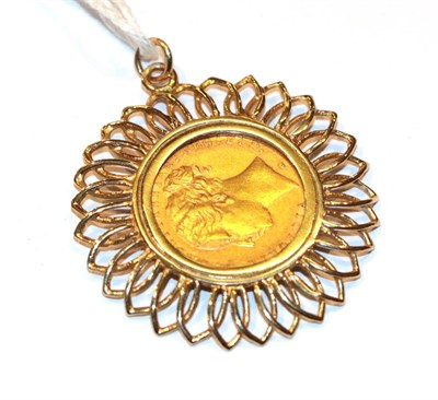 Lot 85 - A sovereign dated 1883 loose mounted as a pendant, length 4.7cm