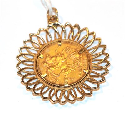 Lot 85 - A sovereign dated 1883 loose mounted as a pendant, length 4.7cm