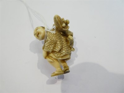 Lot 125 - Japanese ivory netsuke, fisherman with fish and mask, 4.5cm high