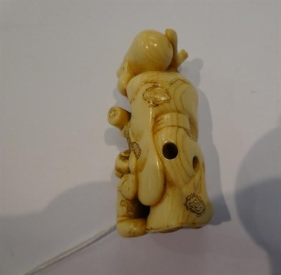 Lot 126 - Japanese ivory netsuke, Jurojin with boy, 5cm high