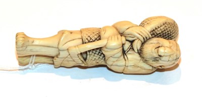 Lot 128 - Japanese ivory netsuke, figure with fish, 7cm high