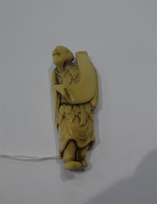 Lot 129 - Japanese ivory netsuke, figure with scroll, 6cm high