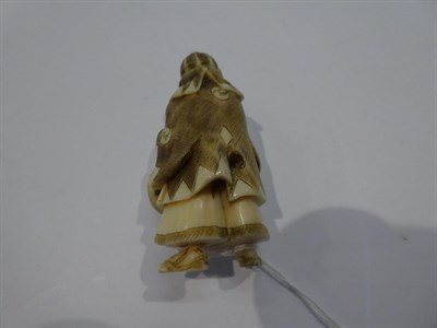 Lot 136 - Japanese ivory netsuke, Samurai with a drum, 5.5cm high; another as Jurojin, 5cm high; and...