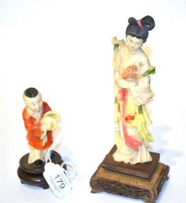 Lot 179 - A Japanese ivory figure of Guan Yin, circa 1920's, 20.5cm; together with a figure of a boy with...