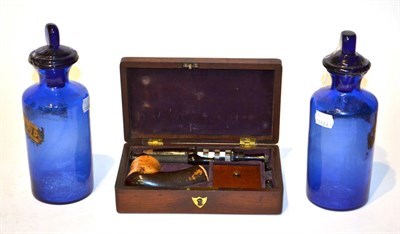 Lot 180 - A pair of blue glass apothecary jars and a cased meerschaum pipe (3)