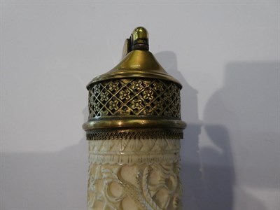 Lot 181 - An early 20th century carved ivory column shaped table lighter, 18cm high