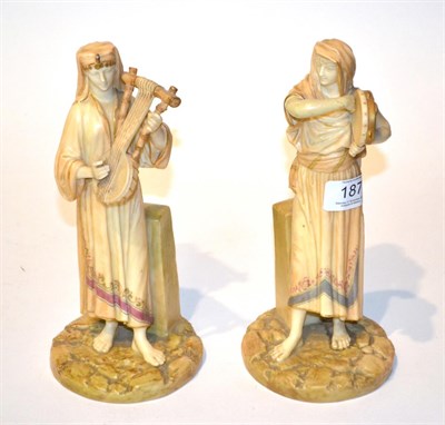 Lot 187 - Two Royal Worcester figures of musicians, model numbers 1084, impressed and puce printed marks...