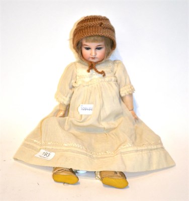 Lot 193 - A late 19th early 20th century bisque head doll marked G K with blue glass eyes