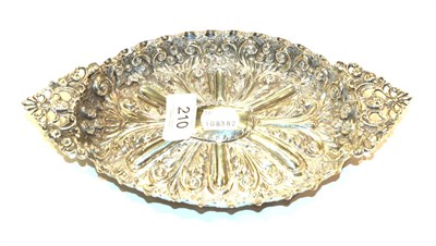 Lot 210 - A Victorian silver dressing table-tray, London, 1899, fluted oval, the sides chased with...