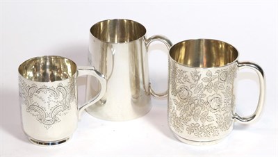Lot 212 - Three silver mugs, the first by Ackroyd Rhodes, London, 1903, cylindrical, engraved with...