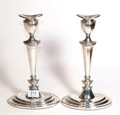 Lot 214 - A pair of Elizabeth II silver candlesticks, by A Taite and Sons Ltd., London, 1966, each on stepped