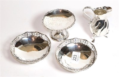 Lot 223 - A group of silver, including: a pair of George V silver dishes, by Edward Souter Barnsley,...