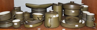 Lot 236 - A large collection of Denby stoneware dinner and tea wares, green ground (one shelf)