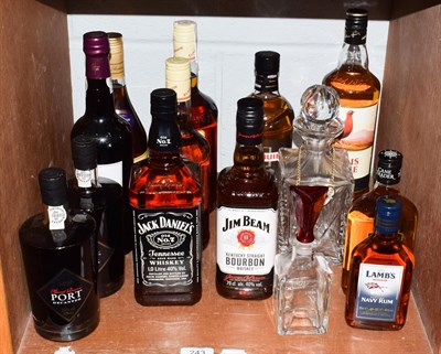 Lot 243 - Mixed spirits including Jack Daniels No.7, Jim Beam Bourbon and decanter, 1 litre of Famous Grouse