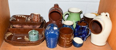 Lot 263 - Group of slip ware pottery including bowls, salt pigs, jugs, etc (one shelf)