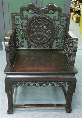 Lot 1449 - A Chinese Carved Hardwood Open Armchair, late 19th/early 20th century, the foliate back support...