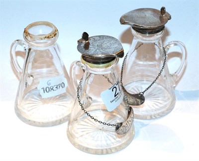 Lot 279 - Two whisky noggins with silver lids and spirit labels together with another glass noggin