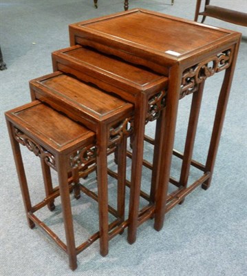 Lot 1450 - A Set of Four 20th Century Chinese Nesting Tables, each of rectangular form with foliate carved...