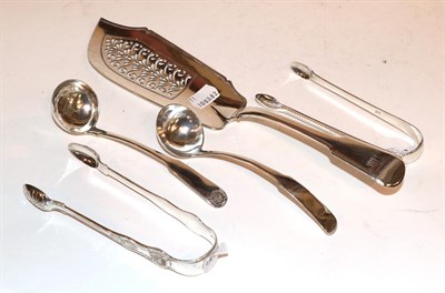 Lot 291 - An early 19th century silver fish slice, together with two Scottish silver sauce ladles and two...