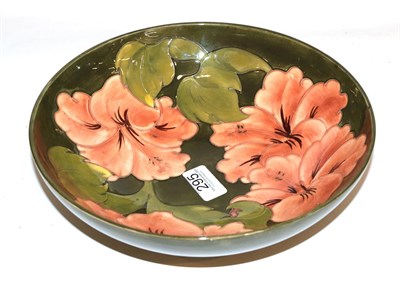 Lot 295 - A large Walter Moorcroft bowl, coral hibiscus pattern on green, 23cm diameter