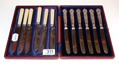 Lot 311 - A set of six Edward VII fruit-knives, by Walker and Hall, Sheffield, 1901, with silver plates...