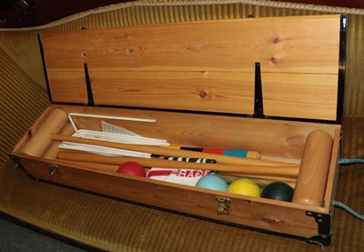 Lot 351 - A modern croquet set in a pine case, containing four croquet mallets, four balls, fours hoops