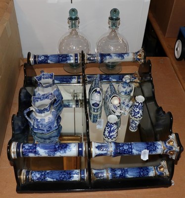 Lot 355 - A set of ebonised and porcelain wall hanging shelves, 44cm high, various blue and white...