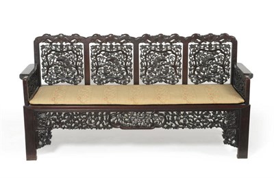 Lot 1460 - An Impressive Chinese Carved Padouk Wood Four-Seater Settee, early 20th century, the foliate...