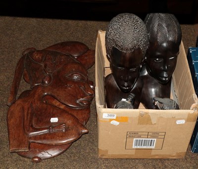 Lot 389 - A pair of Nubian carved busts, a pair of Nubian carved wooden plaques and two African figures (6)