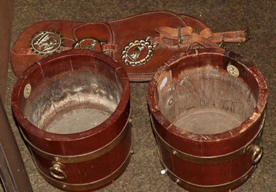 Lot 395 - Two planters in the form of brass bound barrels, 21cm diameter; and horse brasses on two...