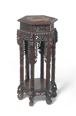 Lot 1462 - A Chinese Carved Padouk Wood Plant Stand, early 20th century, of hexagonal form with inset...