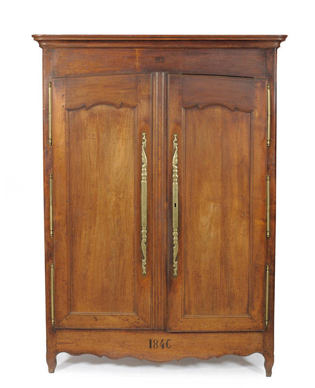 Lot 1465 - A 19th Century Chestnut Armoire, with two panel doors with heavy brass hinges and escutcheons,...