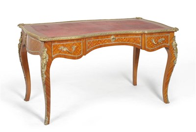 Lot 1466 - A 20th Century Louis XV Style Tulipwood and Gilt Metal Mount Bureau Plat, the top of serpentine...