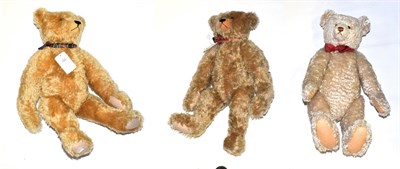 Lot 1023 - Large Steiff 1908 replica teddy bear with red and cream spotty bow tie; and two Atlantic teddy...