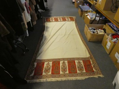 Lot 1036 - Large 19th century cream wool shawl with woven paisley trim, and another similar (both a.f.) (2)