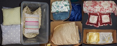 Lot 1051 - Assorted bedding and textiles comprising two cream bed spreads, red and white bed cover,...