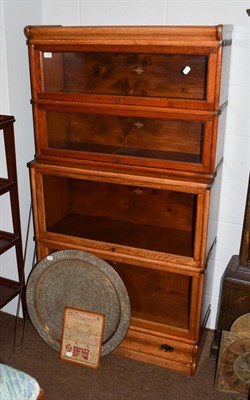 Lot 1182 - An oak Globe Wernicke stacking waterfall bookcase, the moulded top above four tiers and base...