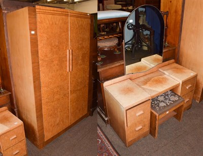Lot 1195 - An Art Deco burr walnut veneered four-piece bedroom suite comprising, double wardrobe, single...