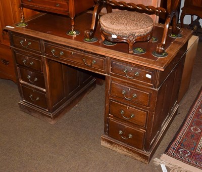 Lot 1198 - A late 19th century oak twin pedestal desk, red leather inset, arrangement of nine drawers,...