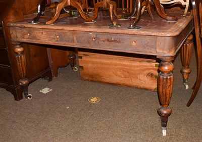 Lot 1200 - An early 19th century oak writing table with red leather inset, twin drawers, reeded baluster...