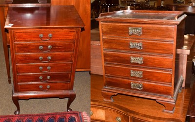 Lot 1202 - An Edwardian mahogany music cabinet, comprising six drawers with fall-front, shaped apron, cabriole