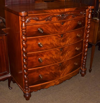 Lot 1212 - A Victorian mahogany bow-fronted four-height chest of drawers, with boldly turned uprights,...